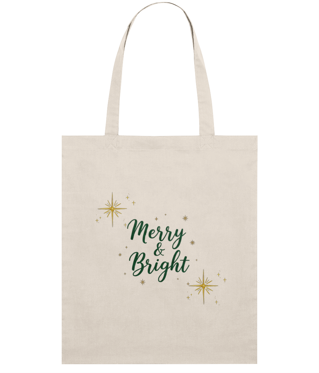 Beige tote bag with 'Merry & Bright' text and star designs on a white background